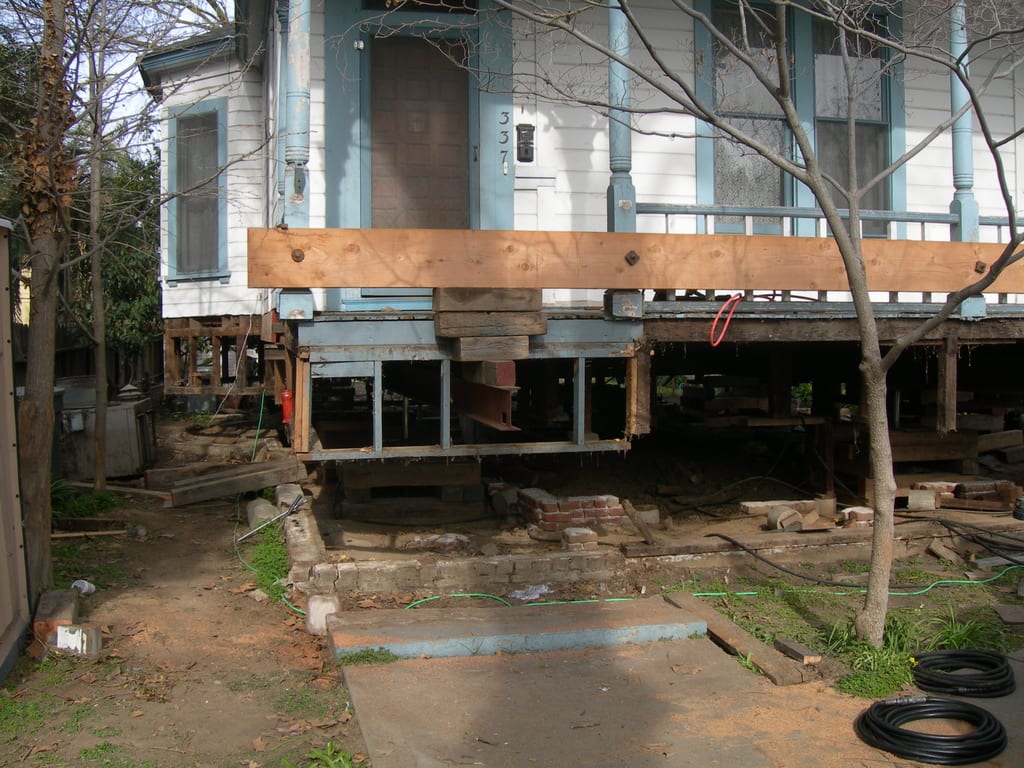 1889 Victorian home restoration: Rebuilding structural floor joists and subflooring over new foundation