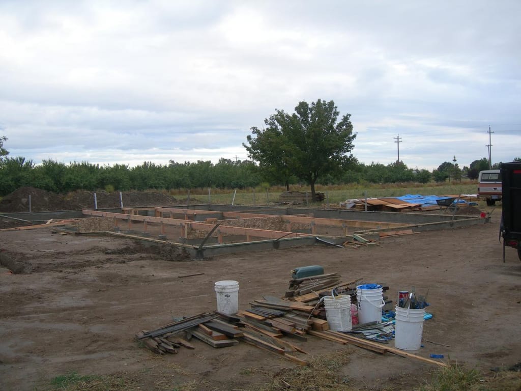 Chowchilla custom home foundation and groundwork: Perimeter wood formwork and compacted foundation sub-base prior to slab pour
