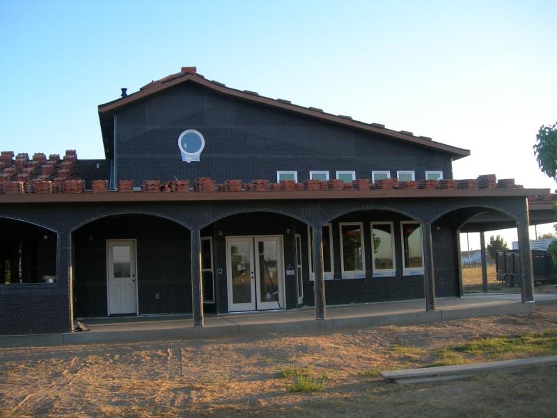 Chowchilla custom home framing and stucco: Applying asphalt felt weather barrier and galvanized wire lath