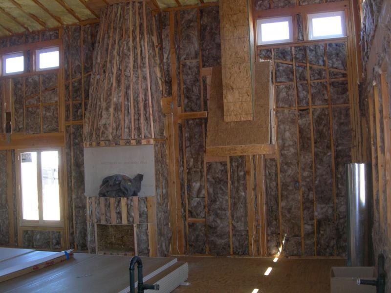 Chowchilla custom home framing and stucco: Rear elevation framing and roof trusses in progress