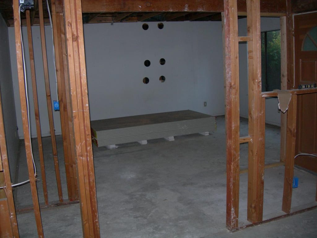 Structural fire damage rebuild: Burn damage across ceiling joists and electrical runs before demo