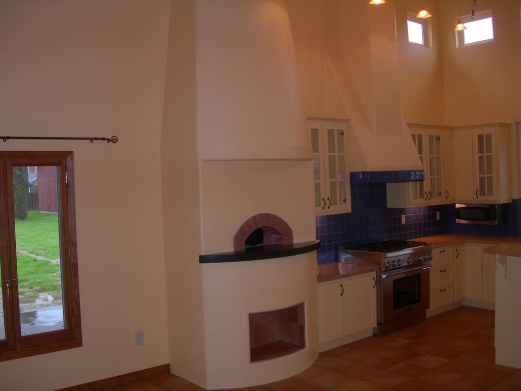 Chowchilla custom home completion: Interior arched hallway framing and drywall mudding