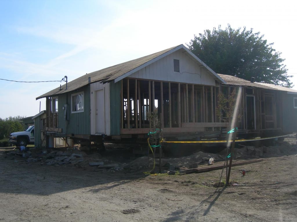 Garcia whole-house strip, foundation lift, and remodel: Rebuilding subfloor framing in front living room and central hallway