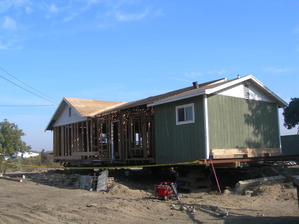 Garcia whole-house strip, foundation lift, and remodel: Reframing interior partitions and rough electrical rewiring throughout