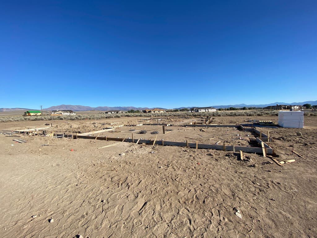 Custom built house in Minden: Perimeter wood foundation forms and steel rebar ready for the concrete pour
